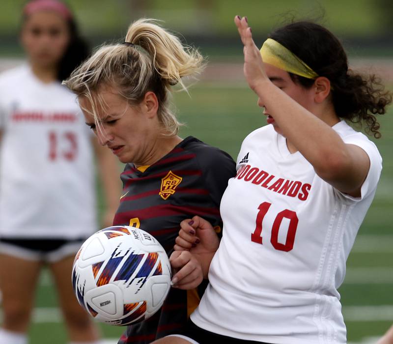 Richmond-Burton's Reese Frericks battles with Woodlands Academy’s Giselle Vazquez for the ball during a IHSA Division 1 Richmond-Burton Sectional semifinal soccer match Tuesday, May 16, 2023, at Richmond-Burton High School.