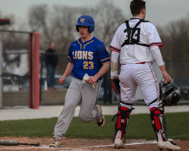 Lyon's Jack McNamara (23) plates a run during baseball game between Lyons at Hinsdale Central. April 19, 2022.