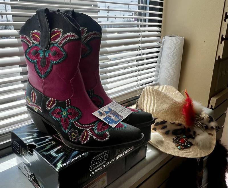 A pair of fashionable boots and a hat at Boots and Boujee Boutique at 3512 E. Lincolnway in Sterling, Illinois.