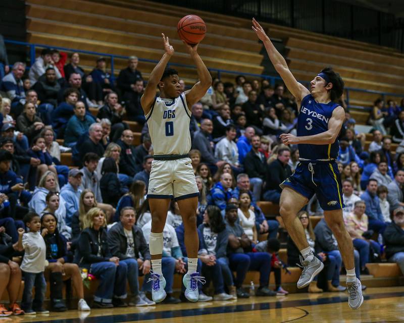 Downers Grove South's Jalen House (0) shoots a jump shot during basketball game between Leyden at Downers Grove South. Feb 9, 2024.