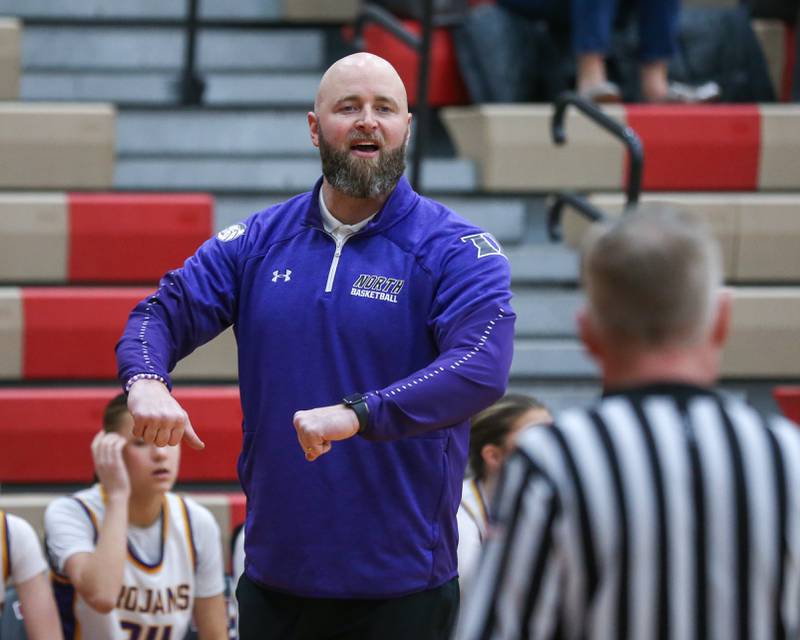 Downers Grove North's head coach Stephan Bolt addresses the referee during their Regional Final basketball game between Downers Grove North at Plainfield North. Feb 20, 2025 in Plainfield.