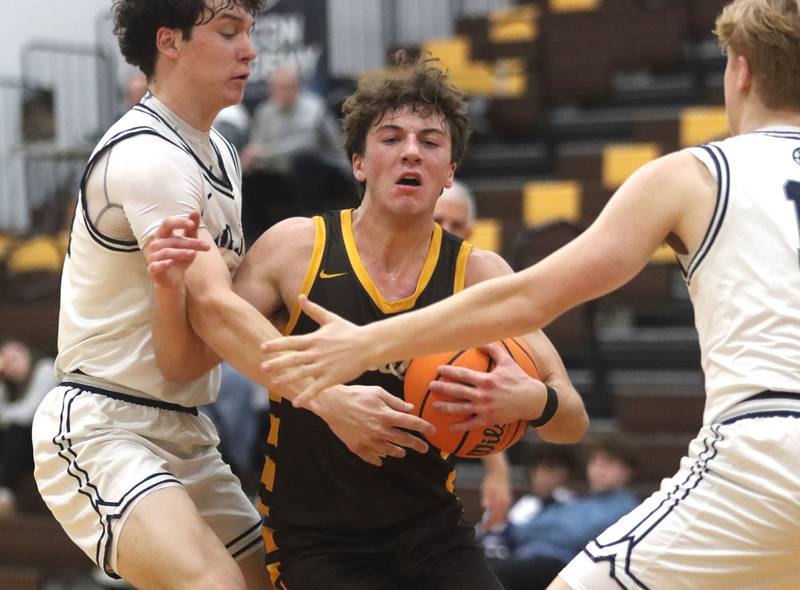 Jacobs’ Ben Jurzak moves the ball against Cary-Grove during Hinkle Holiday Classic varsity boys basketball tournament action on Thursday, Dec. 26, 2024 at Jacobs High School in Algonquin.