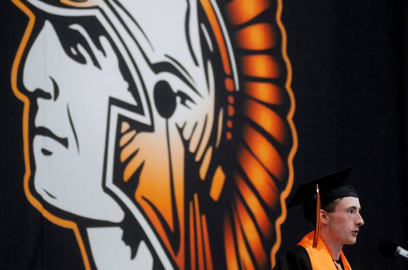 Shane Spatol deliveres his senior poem Saturday, May 21, 2022, during the McHenry High School’s 102nd Commencement Ceremony in the gym of the school’s Upper Campus. The ceremony was moved inside and split into two ceremonies because of the rainy weather.