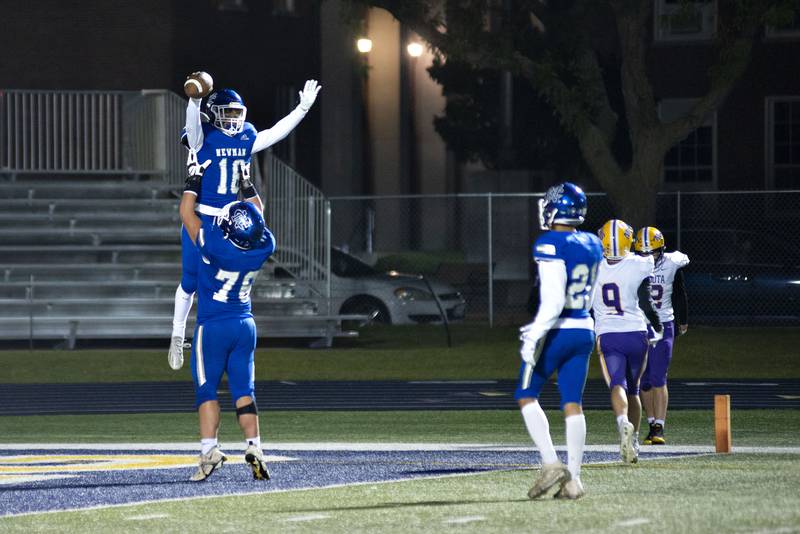 Newman’s Ayden Batten is hoisted by Newman’s Adam Morgan after a touchdown Friday, Oct. 14, 2022 against Mendota.