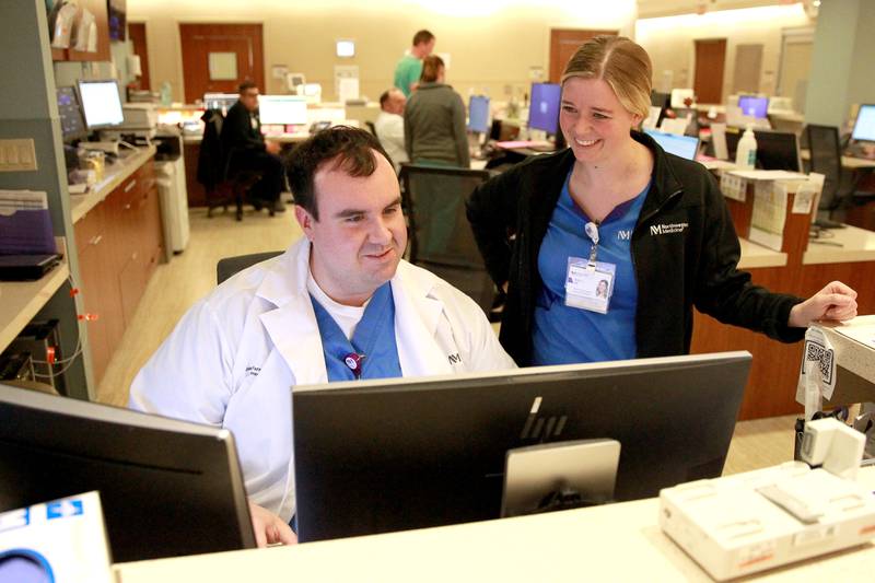 Justin Farmer, emergency department manager, works with registered nurse Allie Spontak at Northwestern Medicine Delnor Hospital in Geneva