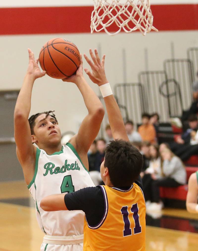 Rock Falls's Devin Tanton-DeJesus shoots a jump shot over Mendota's Iziah Nenez during the 49th annual Colmone Classic on Friday, Dec. 8, 2023 at Hall High School.