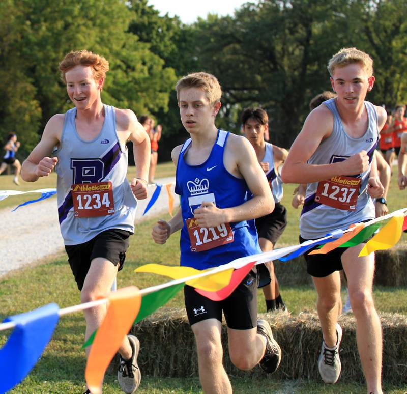 Rochelle's Hunter Bivins (left) and Zach Johnson (right) run during a cross country meet at Skare Park.