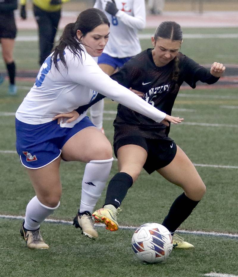 Huntley\s Mia Moyer (right) battles with Larkin’s Angelica Sanchez (left) during a nonconference soccer match against Larkin on Thursday, March 26, 2026, at Huntley High School.