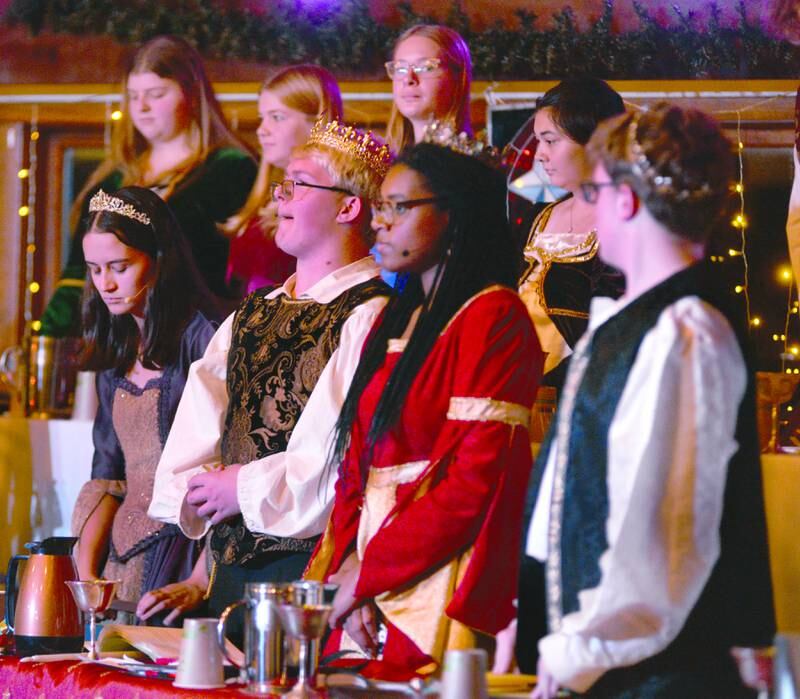 King and Queen Isaac Ebert and Alease McLain (center) along with Prince Caleb Ward (right) and Princess Sarah Eckardt (left) perform a scene during Oregon High School's Madrigal dinner on Saturday, Dec. 7, 2024. The event was held at the Brubaker Center at Stronghold Camp & Retreat Center north of Oregon. The troupe also performed on Friday. Dec. 6.