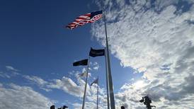 Raynor ceremoniously raises giant American flag above Dixon facility 
