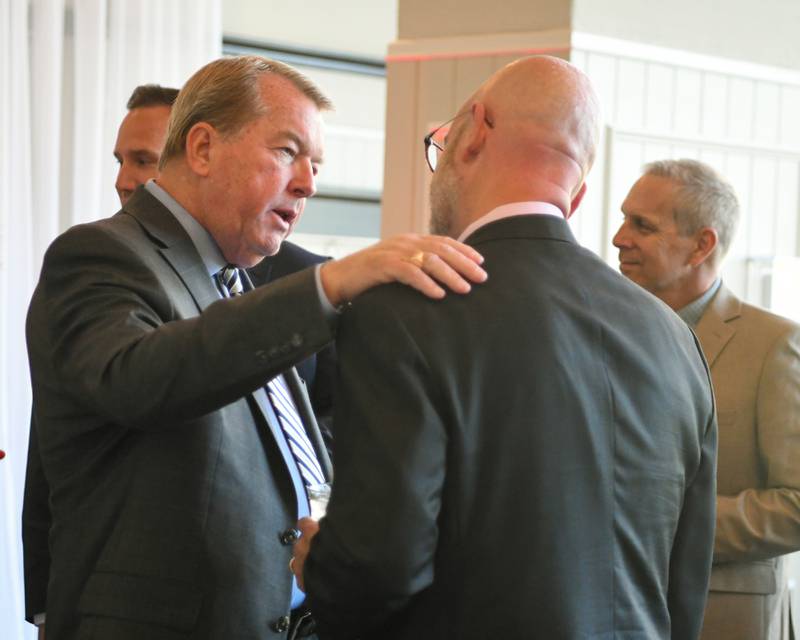 Charlemagne Award nominee Don DeWitte speaks with a fellow attendee on Friday, May 1, 2026, at the Charlemagne Award dinner hosted by the St. Charles Area Chamber of Commerce.