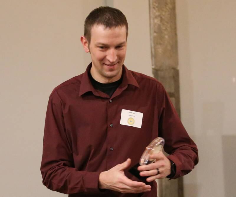 Joe Brizgis, Loan Officer, Eureka Savings Bank, accepts his award during the Illinois Valley Chamber of Commerce 40 Under Forty Awards Gala on Thursday, Feb. 9, 2023 at Westclox in Peru.