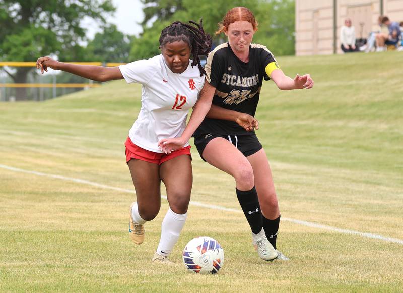Sycamore's Isabelle Segreti kicks and Rock Island's Chukiwa Sudi battle for possession Friday, May 22, 2026, during their Class 2A regional championship matchup at Sycamore High School.