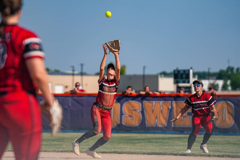 Yorkville's Makenzie Sweeney (4) gets under an infield pop-up for an out against Wheaton Warrenville South during the Class 4A Oswego softball sectional final game between Yorkville and Wheaton Warrenville South at Oswego High School on Friday, June 2, 2023.