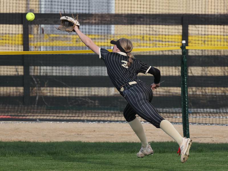 Sycamore's Faith Heil makes a diving attempt for a ball Tuesday, April 22, 2025, during their game against Kaneland at Sycamore High School.
