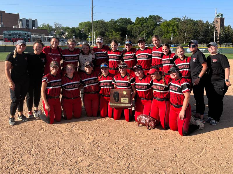 The Yorkville softball team poses with the supersectional plaque after beating Bradley-Bourbonnais 2-0 in the Class 4A Illinois Wesleyan Supersectional on Monday in Bloomington.