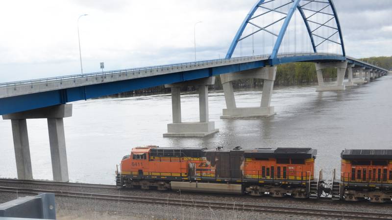 A Burlington Northern-Santa Fe freight train speeds down the track along the Mississippi River north of Savanna on Saturday, April 22.