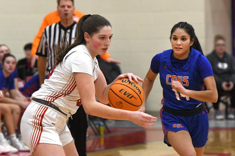 Oregon's Abi Kalnins controls the ball as  Genoa-Kingston's Alexa Ayala defends on Friday, Jan. 30, 2026 at the Blackhawk Center.