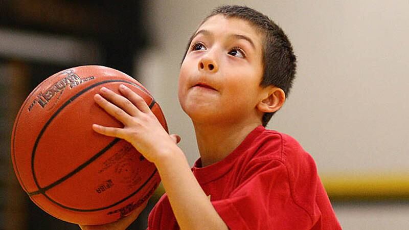 Jackson Lopez, 8, gets ready to attempt a free throw at Sycamore High School during the local round of the Elks National "Hoop Shoot" Free Throw Contest on Saturday, Jan. 7, 2012.