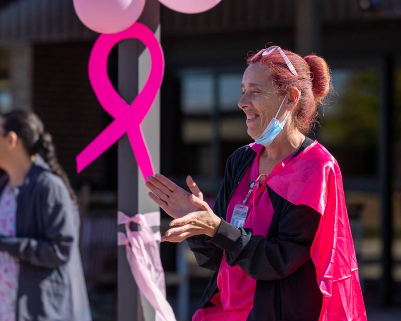 Kelly Robinson claps after resident signs Pink Heals truck on Wednesday, Oct. 8, 2025 at the LaSalle County Nursing Home in Ottawa.