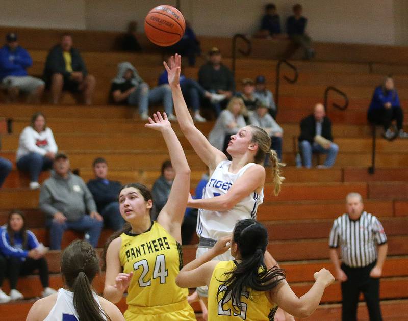 Princeton's Keighley Davis shoots a jump shot over Putnam County's Maggie Richetta and Esmeralda Avila during the Princeton High School Lady Tigers Holiday Tournament on Thursday, Nov. 16, 2023 at Prouty Gym.