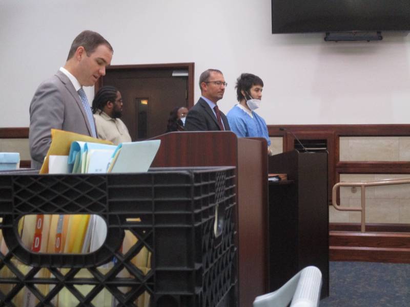 Michael Swift, far right in blue, pleaded guilty to two counts of murder-for-hire on Aug. 22, 2022 at the Kendall County Courthouse. Standing next to Swift is Kendall County Public Defender Jason Majer. At left is Kendall County Assistant State's Attorney Ryan Phelps.