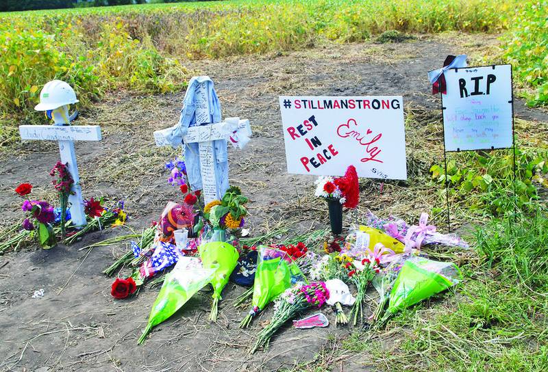 Crosses, flowers and memorial signs were placed at the scene of a Sept. 4 traffic accident near Davis 
Junction that claimed the lives of Andy Conderman and Emily Fleming.