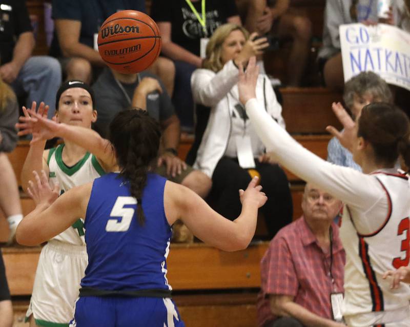 Alden-Hebron’s Jessica Weber passes the ball over Woodstock’s Natalie Morrow during the girl’s game of McHenry County Area All-Star Basketball Extravaganza on Sunday, April 14, 2024, at Alden-Hebron’s Tigard Gymnasium in Hebron.