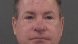 Ex-Bolingbrook music teacher surrenders to police in battery of a minor case