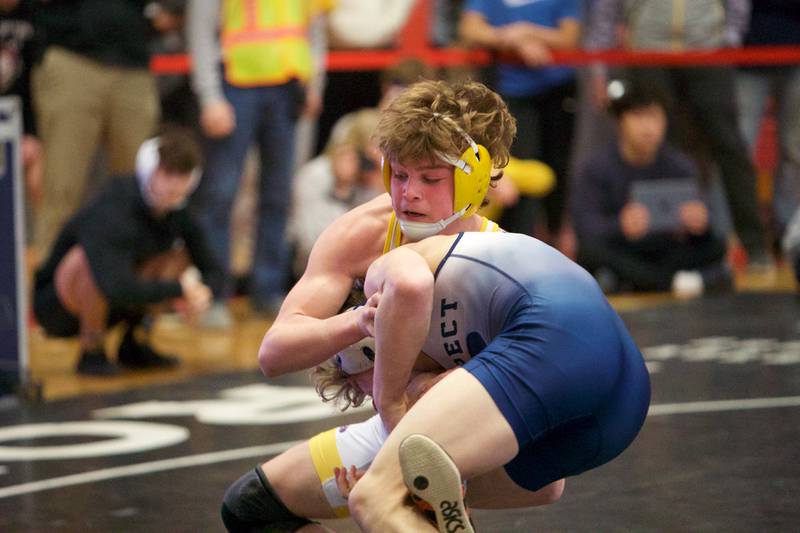 Jacob's James Wright competes against Prospect's Will Baysinger in the 132lb Championship match at the Class 3A Sectional at Barrington High School on Saturday, Feb. 11, 2023.
