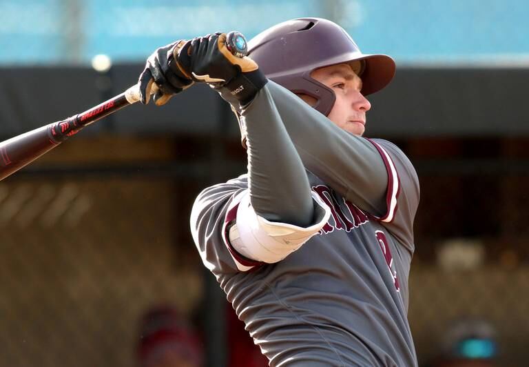 Marengo’s Caden Vogt makes contact against Dundee-Crown during a game March 25, 2022 in Carpentersville.