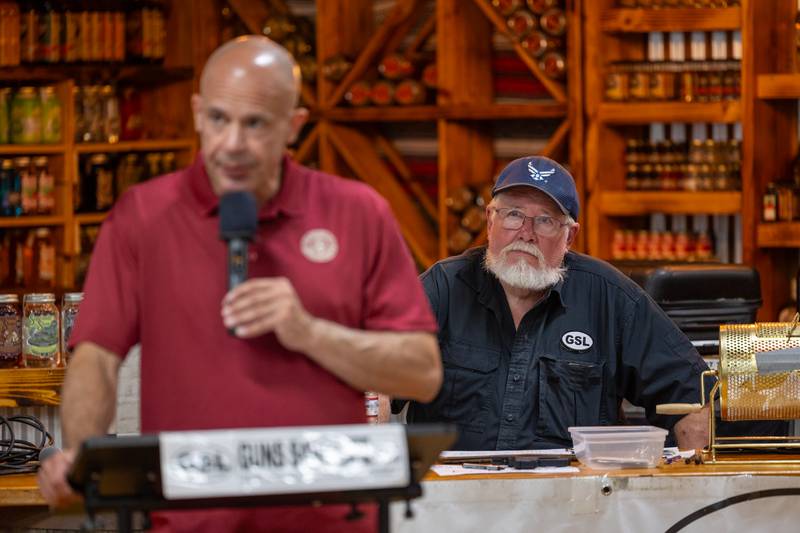Glenn Pratt watches on as John Bosch speaks at 'Guns Save Life' event on Thursday, Aug 21, 2025 at Jamie's Outpost in Utica.