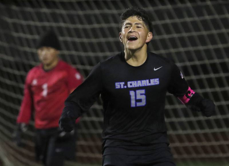 St. Charles North's Wicho DelaPaz celebrates a goal against McHenry's Mason Bertone during an IHSA Class 3A Huntley Regional boys soccer semifinal match on Tuesday, Oct. 21, 2025, at Huntley High School.