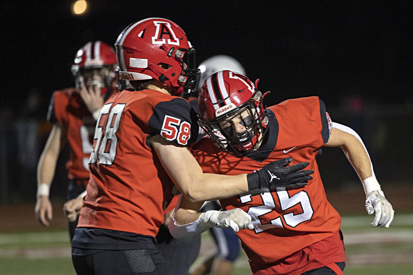 Amboy’s Brayden Klein (right) celebrates his pick six against Ridgewood during the I8FA championship Friday, Nov.17, 2023 at Monmouth College