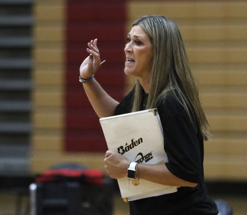 Huntley Head Coach Karen Naymola gives instructions to her team during a Fox Valley Conference volleyball match against Prairie Ridge on Tuesday, Oct. 8, 2024, at Huntley High School.