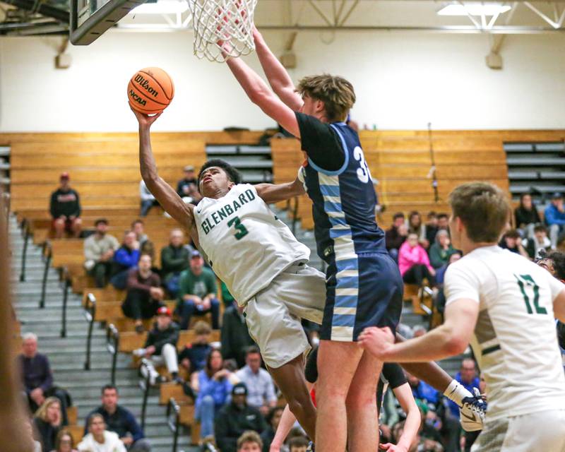 Glenbard West's TJ Williams (3) puts up an off-balanced shot during their Jack Tosh Holiday Classic basketball tournament game between Nazareth vs Glenbard West. Thursday Dec 26, 2024 in Elmhurst.