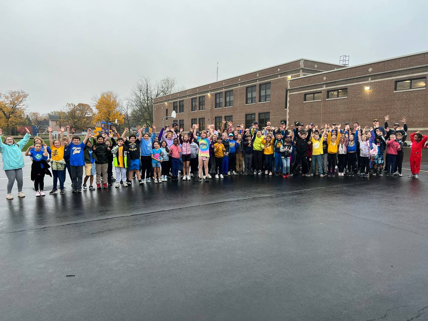 Students at Lincoln Elementary School pose with first responders after the kickball game Friday, Oct. 27, 2023, in Mendota
