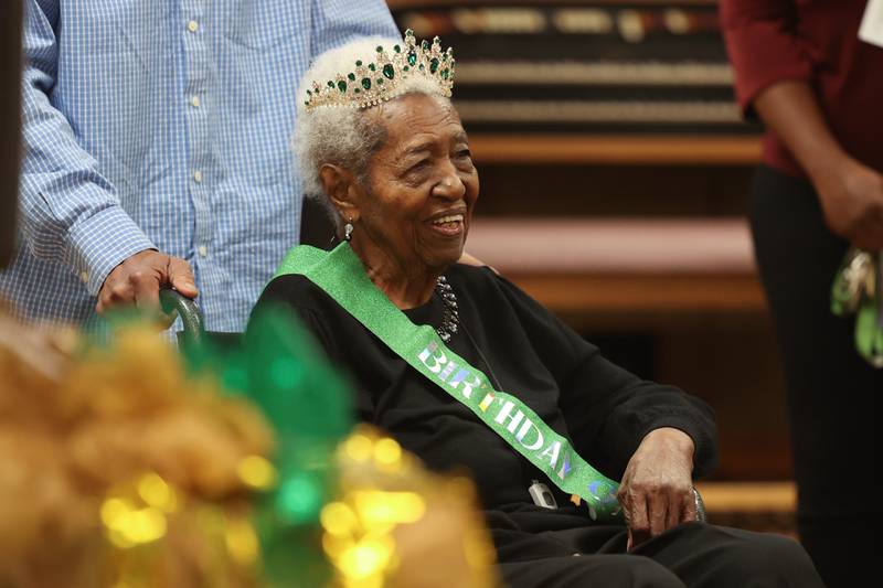 Mary Martha Thompson makes her entrance for her 105th birthday party at Joshua Arms Senior Residences on Monday, Oct. 9, 2023 in Joliet.
