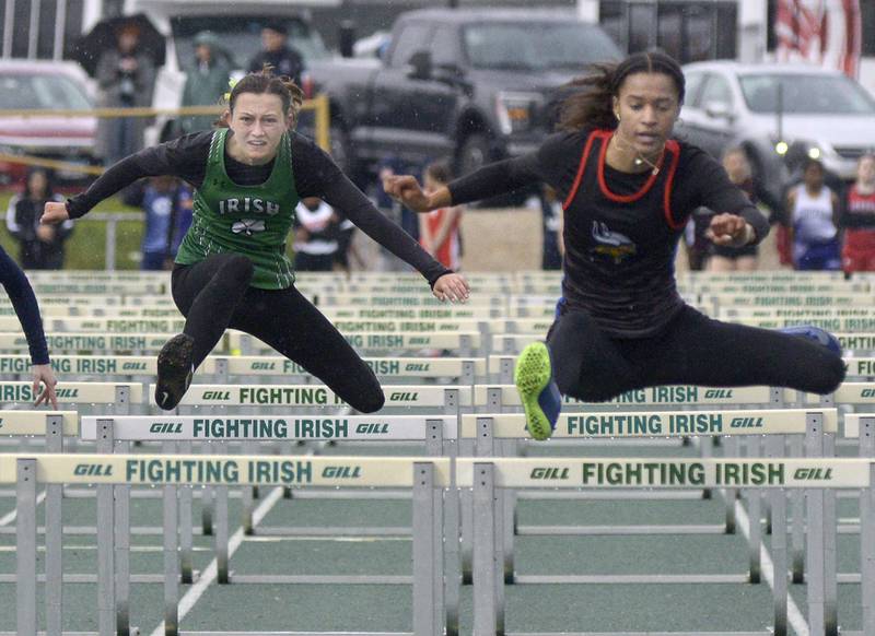 Seneca’s Lilly Pfeifer and Newark’s Kiara Wesseh in the 100 meter hurdles Thursday’s sectional at Seneca.