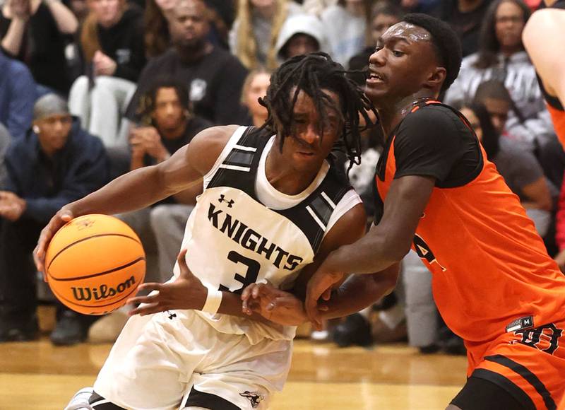 Kaneland's Marshawn Cocroft drives the lane against DeKalb's Marquise Bolden during their game Tuesday, Jan. 28, 2025, at Kaneland High School in Maple Park.