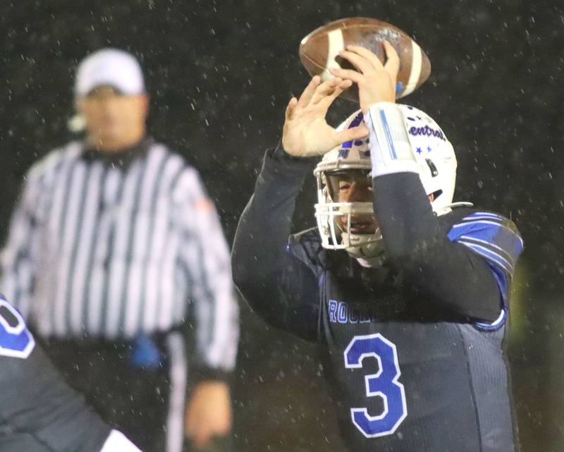 A snap flies past Burlington Central’s Landon Arnold against Harlem in IHSA football Class 6A second-round playoff action at Central High School in Burlington on Saturday, November 8, 2025.
