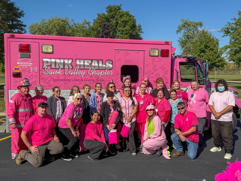 Nursing staff pose for photo in front of the Pink Heals Truck from the Rock Falls chapter sits in parking lot on Wednesday, Oct. 8, 2025 at the LaSalle County Nursing Home in Ottawa.