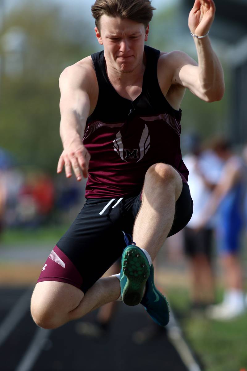 Marengo’s Drew Palanos competes in the triple jump during Kishwaukee River Conference track meet action at Marengo Tuesday night.