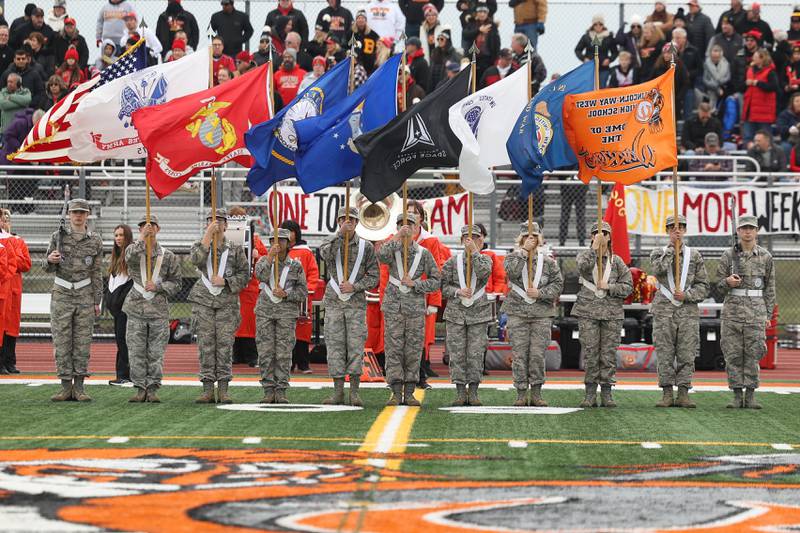 Lincoln-Way West's Air Force Junior ROTC presents the colors before the game against Batavia on Saturday, Nov. 9, 2024 in New Lenox.