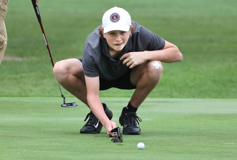 Ottawa’s Bryer Harris lines up a putt Wednesday, Sept. 27, 2023, during the Class 2A boys golf regional at Sycamore Golf Club.