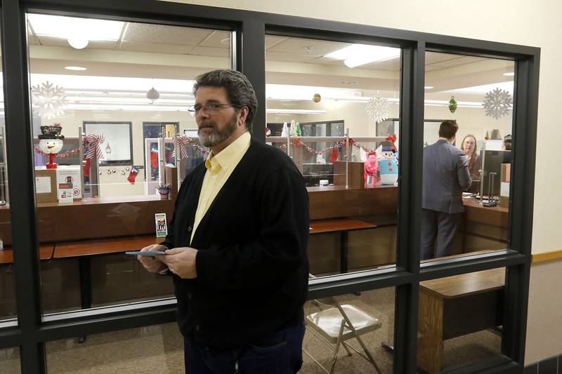 McHenry Count Clerk Joe Tirio waits to hand out time cards to any candidates that might file their candidate forms in the last hour on Monday, Dec. 4, 2023, at the McHenry County Clerk's Office in Woodstock. Monday was the last day for candidates to file ahead of the March primaries.