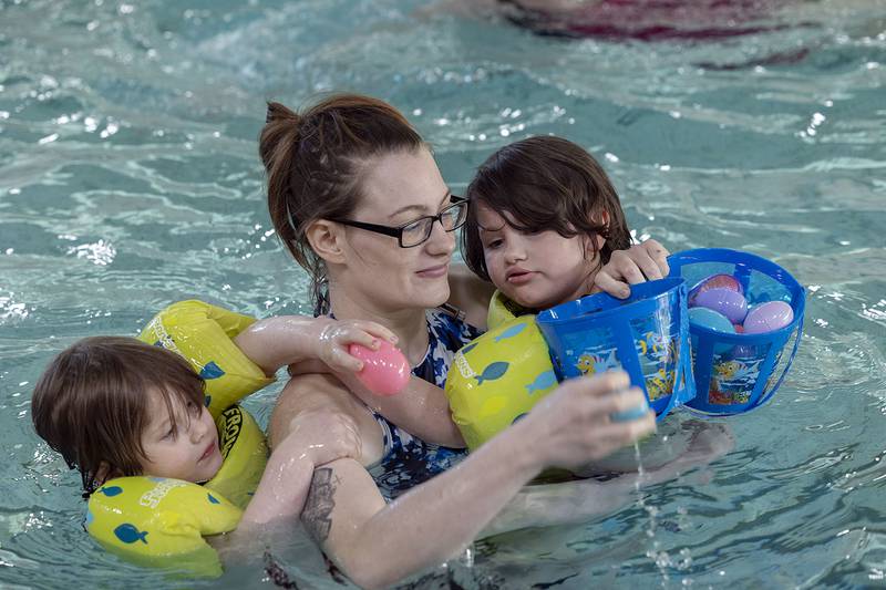 Shanda Witherow with Valentina (left), 5, and Makayla Gehrig, 6, in tow participates in the Sterling-Rock Falls YMCA Easter Egg Hunt Friday, April 11, 2025.