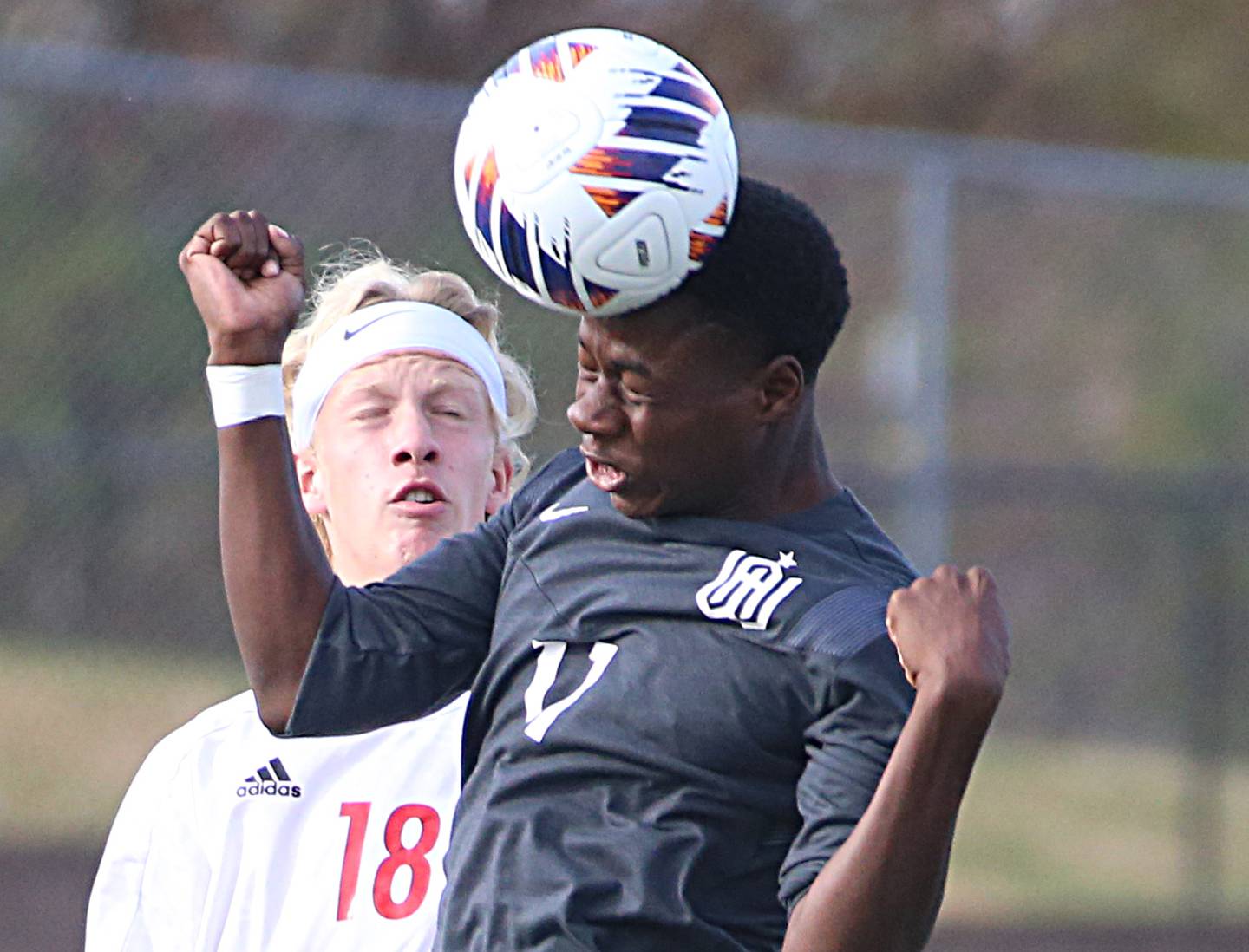 Wheaton Academy's Josiah Pitts (11) beats Timothy Christian's Marc Gambel Jr. to a header during the Class 1A State soccer third place game on Saturday, Oct. 29, 2022 at EastSide Centre in Peoria.