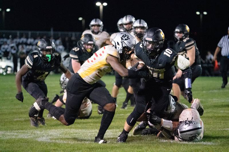 Sycamore's Zack Crawford (10) carries the ball against Kaneland during a football game at Kaneland High School in Maple Park on Friday, Sep 30, 2022.