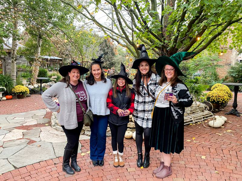 Costume-clad event-goers enjoy Witches Night Out, an evening of drinks and shopping, in Sycamore in October 2023. This year's event will run 4 to 8 p.m. Oct. 10, 2024.